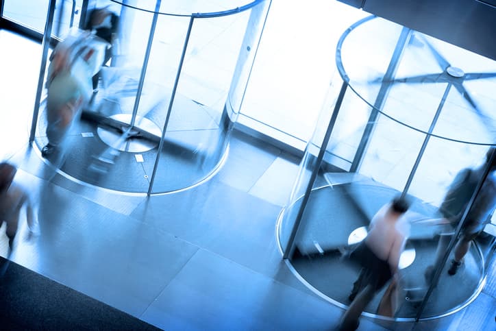 People going through a pair of revolving doors.Please see some similar pictures from my portfolio: