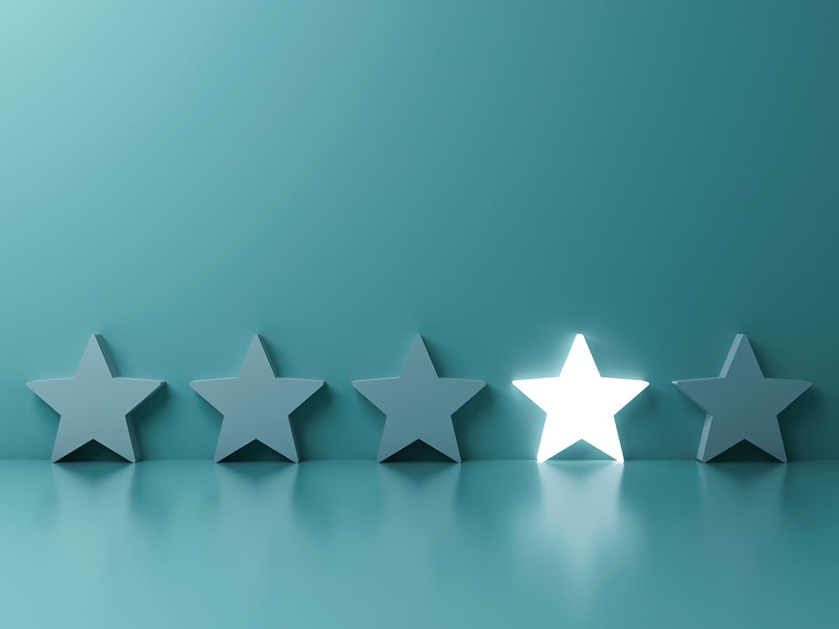 Five stars against a blue background. The fourth star is lit up.