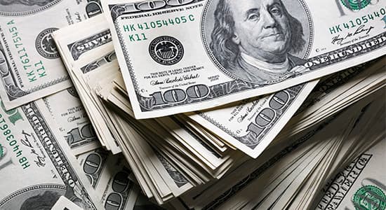 Piles of one hundred US dollar bills