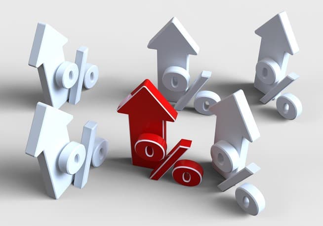 Series of white and red arrows pointing up with a percentage symbol beside them