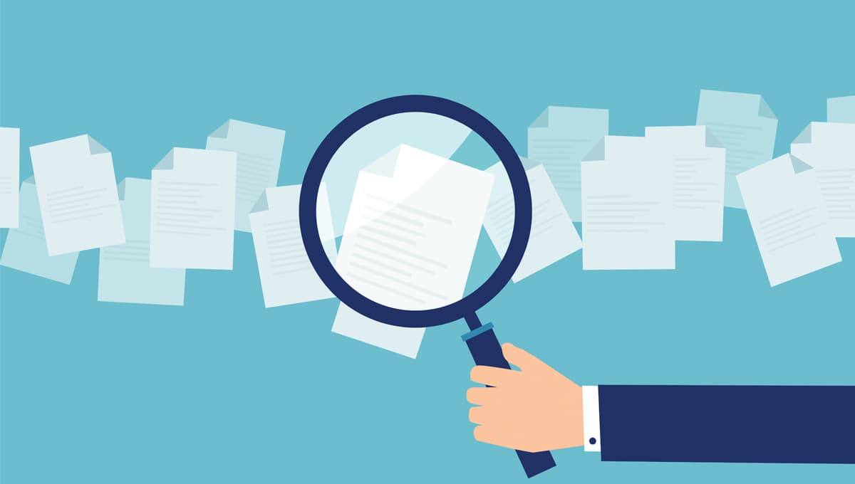 Illustration of a magnifying glass examining documents
