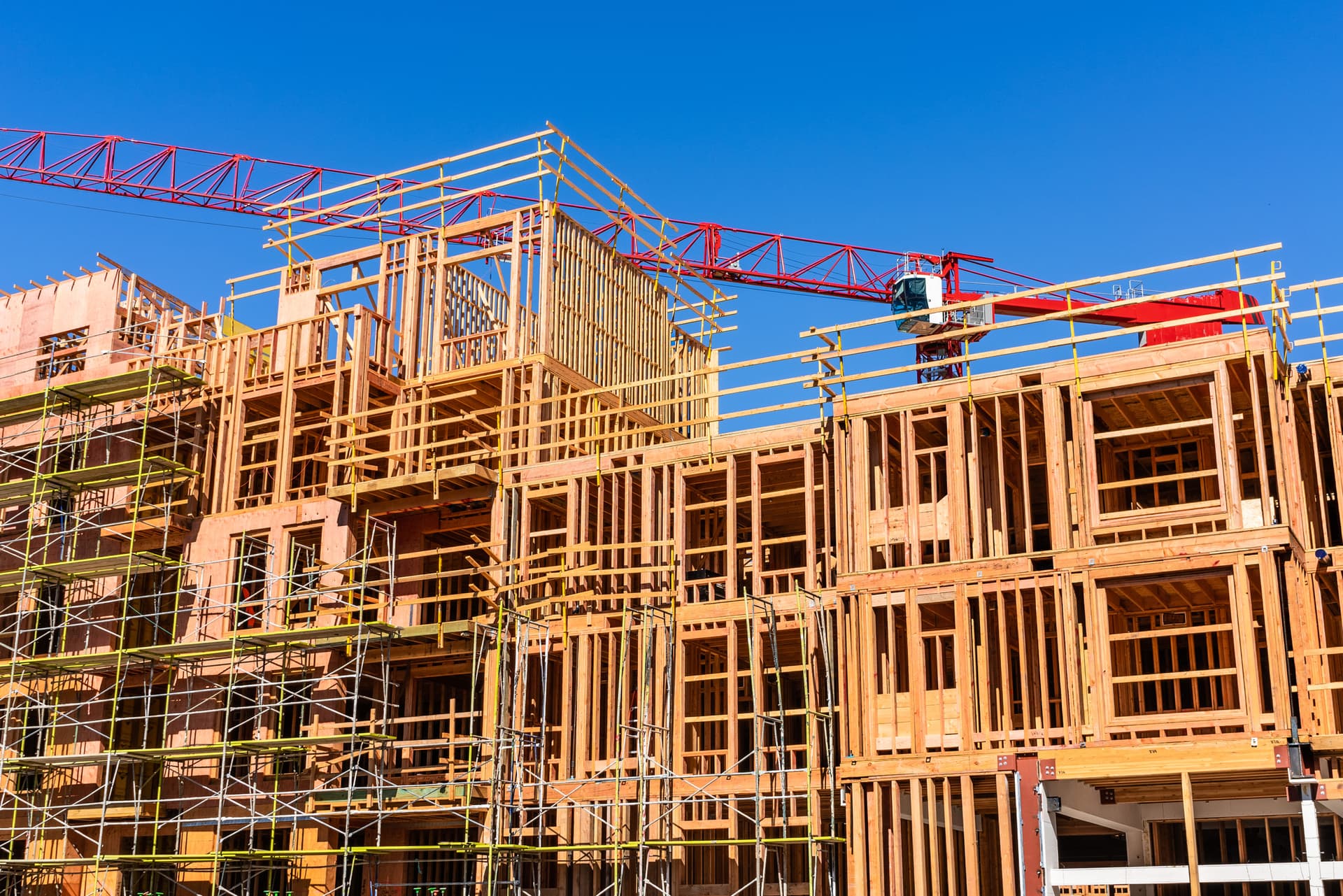 Exterior view of multifamily residential building under construction in Palo Alto; the entire Silicon Valley and San Francisco Bay Area is facing a housing crisis, with increased housing costs.