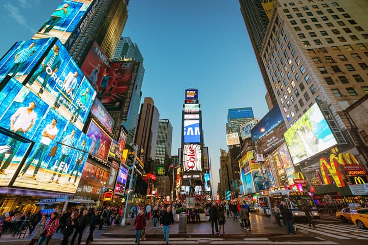 Amazing vibrant Times Square crowded with tourists and people sightseeing. New York City, Manhattan, USA.