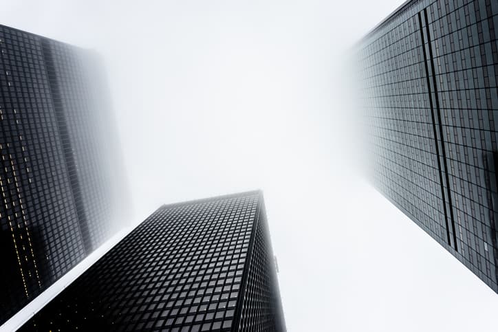 Office buildings surrounded by fog.