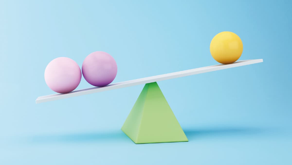 Graphic of two purple spheres and one yellow sphere balancing on top of a green triangle