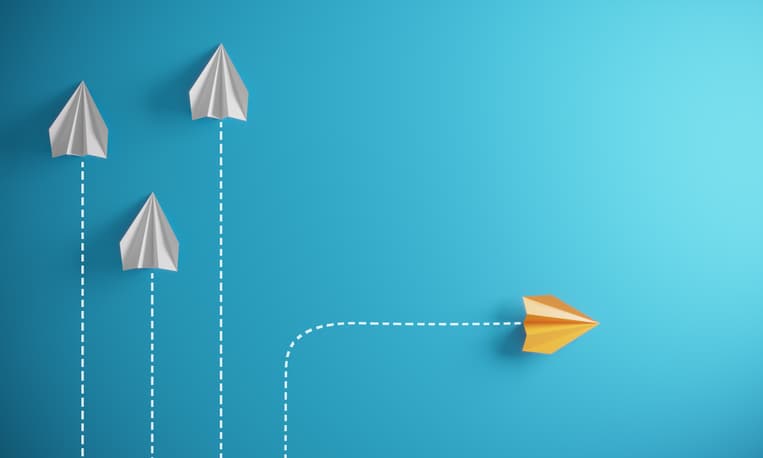 Group of paper airplane in one direction and with one individual pointing in the different way, can be used leadership/individuality/innovation concepts.( 3d render )