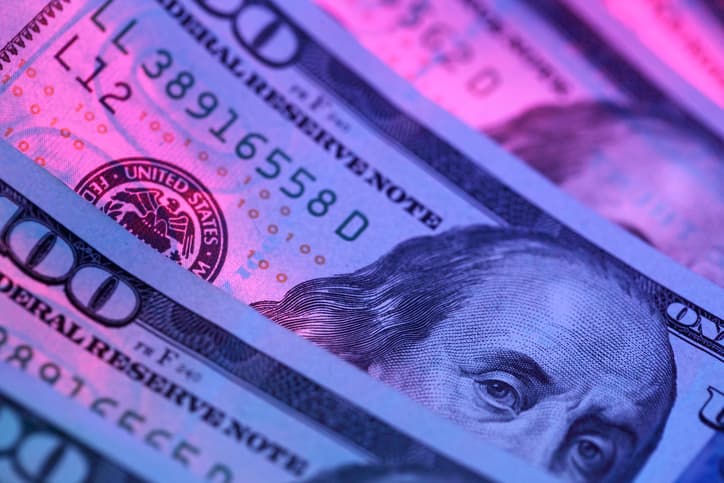 Hundred dollar bill in abstract lighting