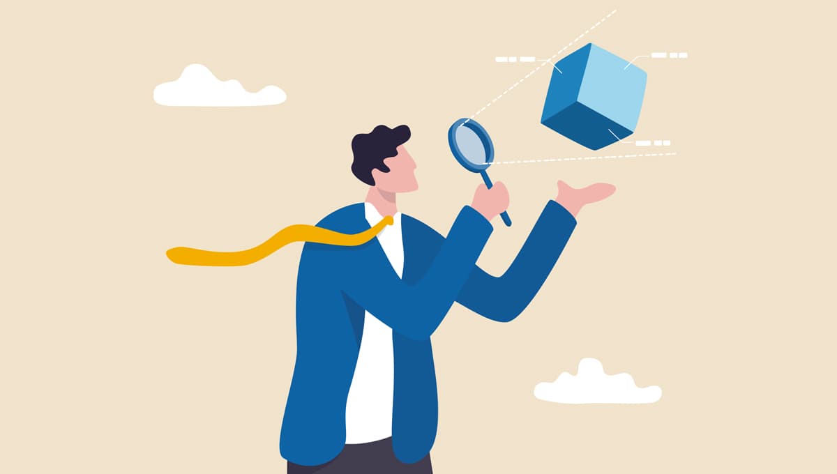 Image of a man holding a magnifying glass, observing a cube.