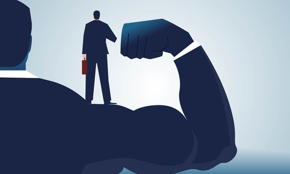 Illustration of a strong business person standing behind a person in a suit.