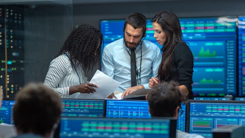 Photo of a team analyzing data