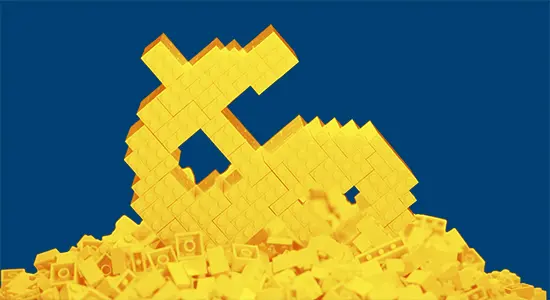 A dollar sign compromised of lego bricks collapses and sinks into a pile of lego bricks
