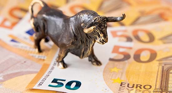 Bull ornament on top of 50 euro notes